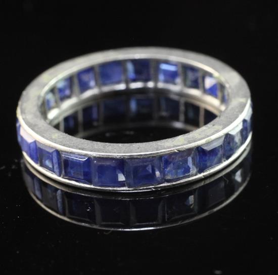 A platinum and sapphire full eternity ring, size L.